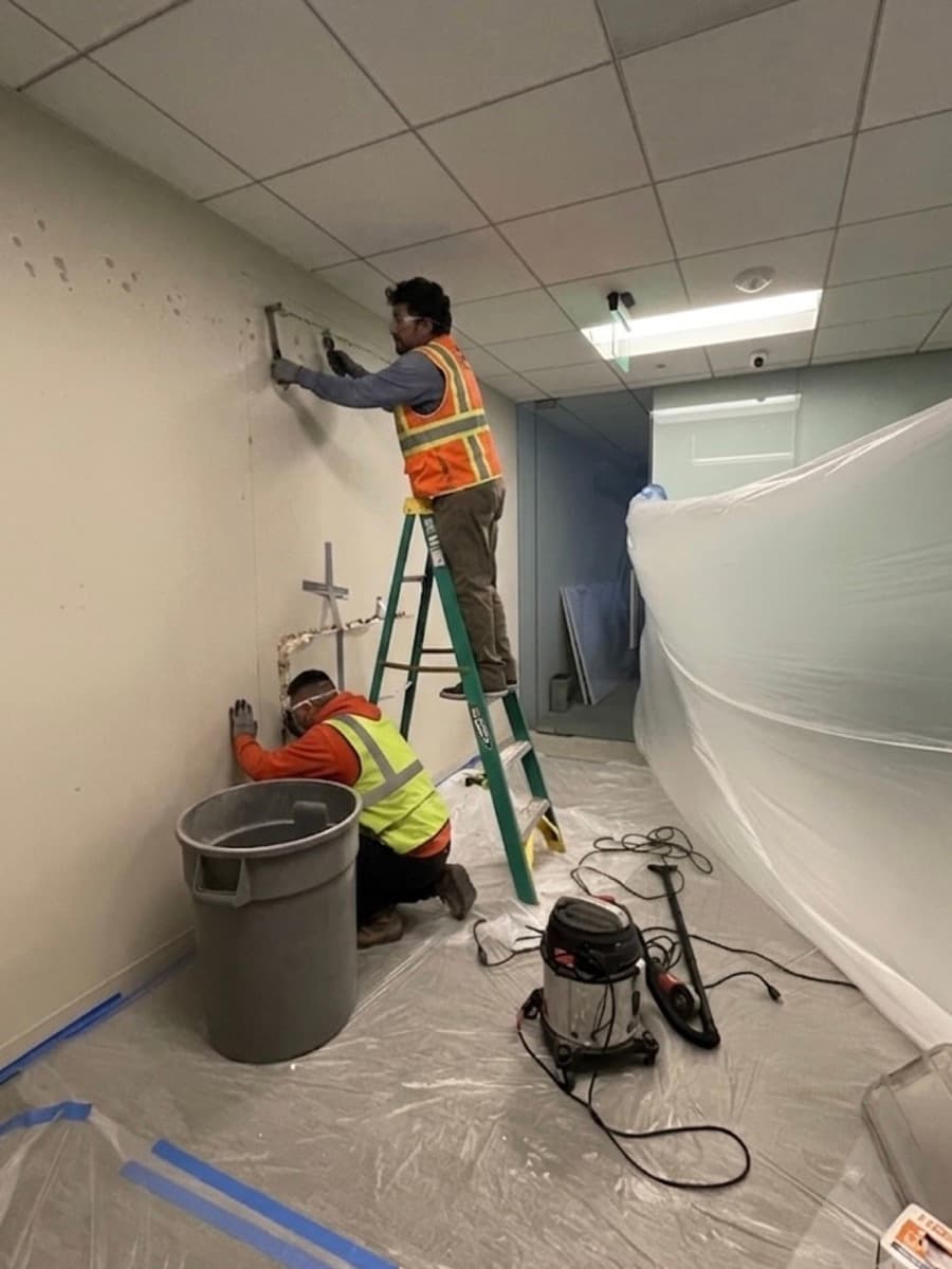 Commercial interior demolition with dust containment and cleanup