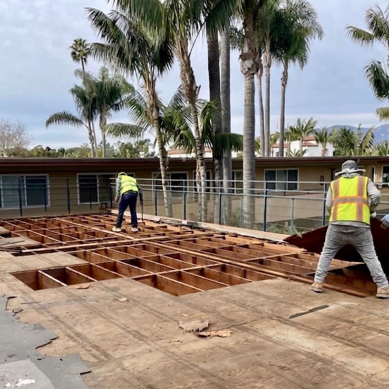 Junk Tigers crew tearing out a large deck down to the joists at a Southern California property